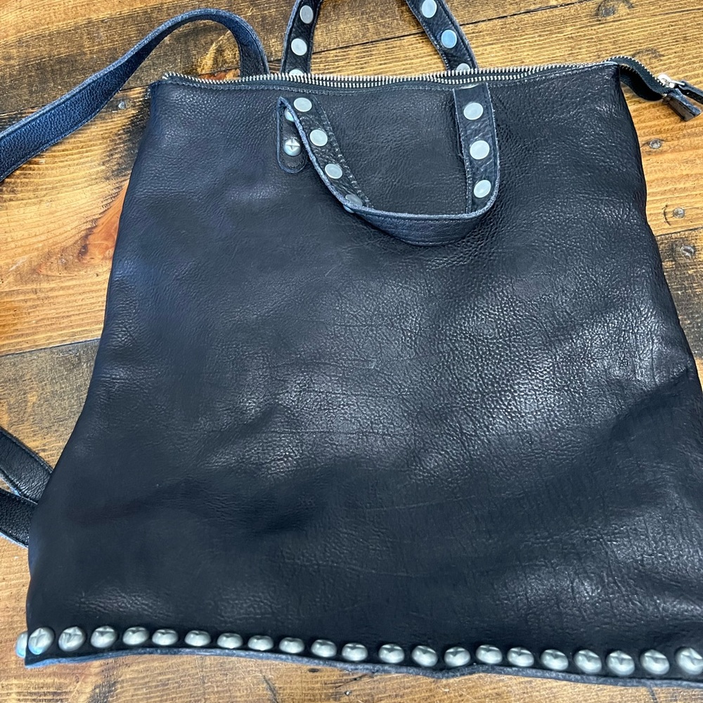 Free people backpack. Black leather with silver studs.